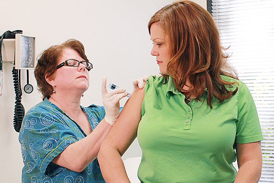Nurse giving vaccine injection